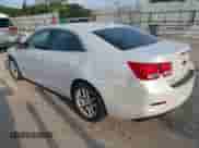 2015 Chevrolet Malibu LT with VIN 1G11C5SL9FF318648, listed as a IAAI auction lot 43322404 with 145,757 mi miles and . Bid and sale history available at DreamBid. Image 3.