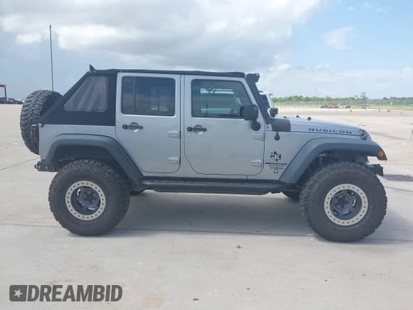 ✅ 2015 Jeep Wrangler Unlimited Rubicon Hard Rock • VIN: 1C4HJWFG1FL718588 • Lot: 42662414. Listed on IAAI with 84,087 mi. Free auction sales archive from the USA and detailed vehicle history report at DreamBid. Image 13.