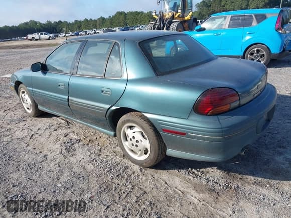 ✅ 1996 Pontiac Grand Am SE • VIN: 1G2NE52M7TC721718 • Lot: 43268073. Wystawiony na IAAI z przebiegiem 115 223 mil. Bezpłatny archiwum sprzedaży aukcyjnych z USA i szczegółowy raport historii pojazdu na DreamBid. Zdjęcie 3.