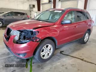 2012 Hyundai Santa Fe GLS with VIN 5XYZGDAB7CG129958, listed as a Copart auction lot 70648355 with 164,473 mi miles and Salvage title. Bid and sale history available at DreamBid. Image 1.