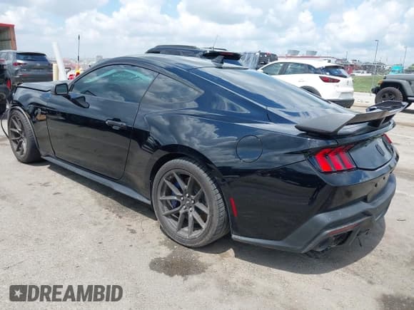 ✅ 2024 Ford Mustang Dark Horse • VIN: 1FA6P8R00R5505811 • Lot: 42894731. Listed on IAAI with 5,395 mi. Free auction sales archive from the USA and detailed vehicle history report at DreamBid. Image 3.