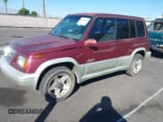 ✅ 1998 Suzuki Sidekick • VIN: JS3TD21V2W4109389 • Lot: 43534824. Listed on IAAI with 197,635 mi. Free auction sales archive from the USA and detailed vehicle history report at DreamBid. Image 12.