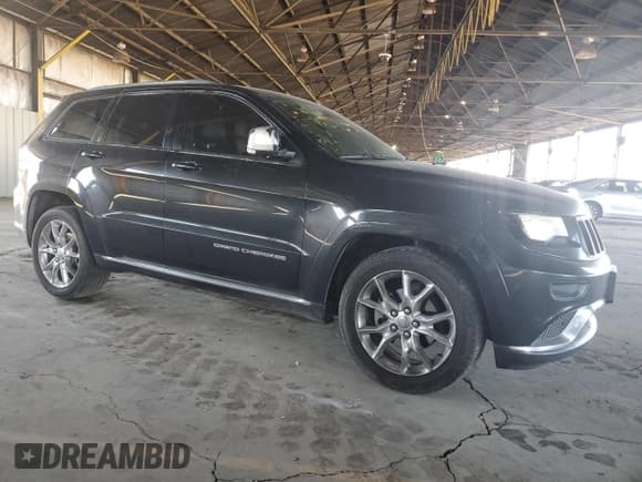 ✅ 2014 Jeep Grand Cherokee • VIN: 1C4RJEJM8EC424373 • Lot: 72256674. Listed on Copart with 128,998 mi. Free auction sales archive from the USA and detailed vehicle history report at DreamBid. Image 4.