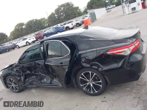 2019 Toyota Camry LE with VIN 4T1B11HK2KU833243, listed as a IAAI auction lot 42855313 with 128,404 mi miles and . Bid and sale history available at DreamBid. Image 14.