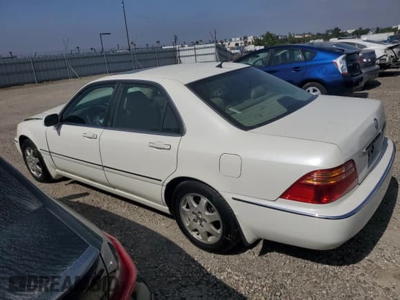 ✅ 2002 Acura RL • VIN: JH4KA96522C011028 • Lot: 61027505. Listed on Copart with 104,094 mi. Free auction sales archive from the USA and detailed vehicle history report at DreamBid. Image 2.