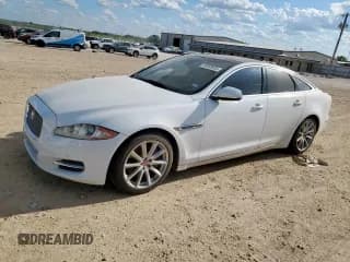 ✅ 2014 Jaguar XJ • VIN: SAJWA1CZ2E8V59275 • Lot: 68568925. Wystawiony na Copart z przebiegiem 74 696 mil. Bezpłatny archiwum sprzedaży aukcyjnych z USA i szczegółowy raport historii pojazdu na DreamBid. Zdjęcie 1.