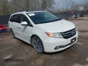 ✅ 2014 Honda Odyssey Touring • VIN: 5FNRL5H94EB057681 • Lot: 41828000. Listed on IAAI with 249,350 mi. Free auction sales archive from the USA and detailed vehicle history report at DreamBid. Image 1.