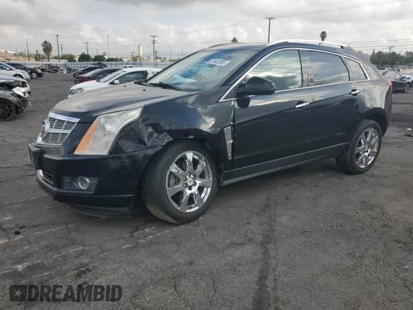 ✅ 2012 Cadillac SRX Performance Collection • VIN: 3GYFNBE31CS577198 • Lot: 81932555. Listed on Copart with 194,810 mi. Free auction sales archive from the USA and detailed vehicle history report at DreamBid. Image 1.