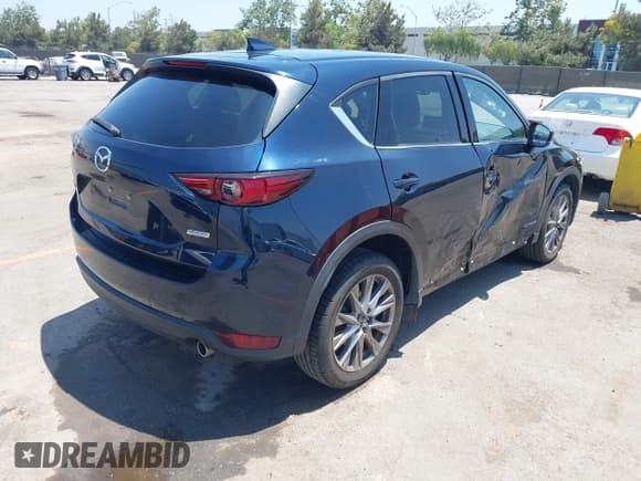 ✅ 2019 Mazda CX-5 Grand Touring • VIN: JM3KFADM6K1631110 • Lot: 42615837. Listed on IAAI with 63,764 mi. Free auction sales archive from the USA and detailed vehicle history report at DreamBid. Image 4.