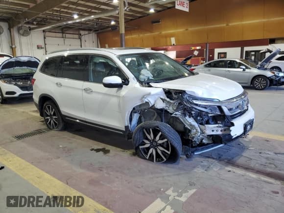 ✅ 2022 Honda Pilot Touring 7-Passenger • VIN: 5FNYF6H69NB029700 • Lot: 86212445. Listed on Copart with Not provided. Free auction sales archive from the USA and detailed vehicle history report at DreamBid. Image 4.