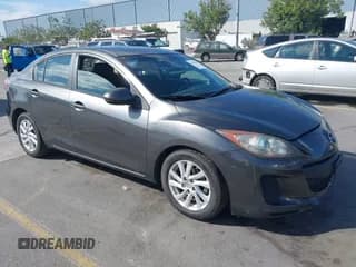 ✅ 2012 Mazda 3 i Touring • VIN: JM1BL1V81C1643685 • Lot: 42849193. Listed on IAAI with 196,748 mi. Free auction sales archive from the USA and detailed vehicle history report at DreamBid. Image 1.