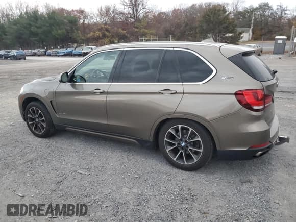 ✅ 2017 BMW X5 xDrive40e • VIN: 5UXKT0C34H0S80828 • Lot: 92358125. Listed on Copart with 111,500 mi. Free auction sales archive from the USA and detailed vehicle history report at DreamBid. Image 2.