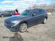 ✅ 2014 BMW X1 xDrive28i • VIN: WBAVL1C51EVY23554 • Lot: 43699873. Listed on IAAI with 123,313 mi. Free auction sales archive from the USA and detailed vehicle history report at DreamBid. Image 2.