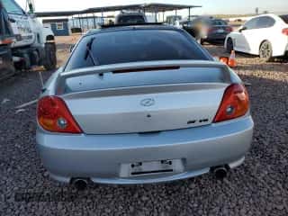 2004 Hyundai Tiburon GT z VIN KMHHN65F44U130202, wystawiony jako Copart lot #43193404 z przebiegiem 207 694 mil mil oraz Szkoda całkowita • Salvage title. Historia ofert i sprzedaży dostępna na DreamBid. Obrazek 6.