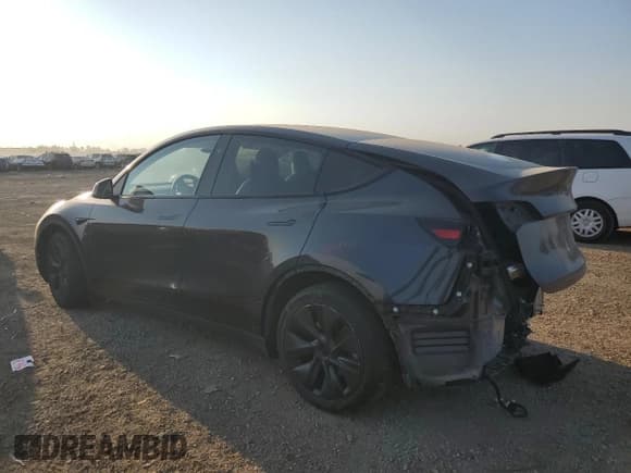 ✅ 2025 Tesla Model Y Long Range • VIN: 7SAYGAEE2SF218229 • Lot: 84790895. Listed on Copart with 51,018 mi. Free auction sales archive from the USA and detailed vehicle history report at DreamBid. Image 2.