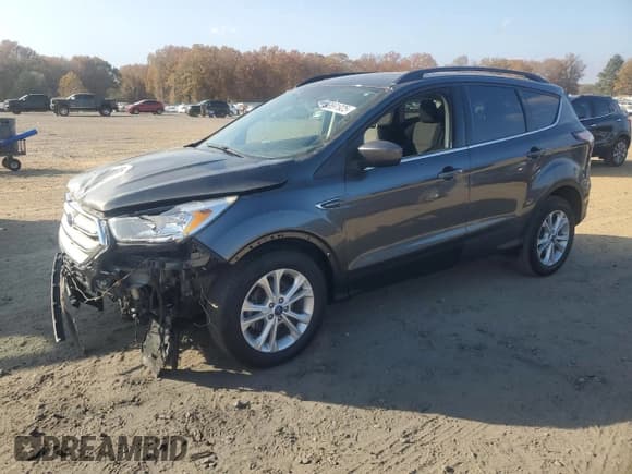 ✅ 2018 Ford Escape SE • VIN: 1FMCU0GD1JUB76040 • Lot: 93691925. Listed on Copart with 141,946 mi. Free auction sales archive from the USA and detailed vehicle history report at DreamBid. Image 1.