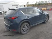 ✅ 2018 Mazda CX-5 Touring • VIN: JM3KFBCM5J0406446 • Lot: 43521437. Listed on IAAI with 148,227 mi. Free auction sales archive from the USA and detailed vehicle history report at DreamBid. Image 4.