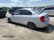 2010 Hyundai Accent GLS z VIN KMHCN4AC6AU468660, wystawiony jako Copart lot #66367444 z przebiegiem 104 341 mil mil oraz Szkoda całkowita • Salvage title. Historia ofert i sprzedaży dostępna na DreamBid. Obrazek 2.