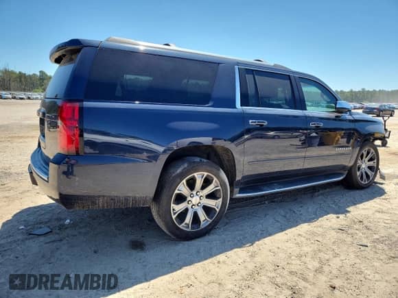 2019 Chevrolet Suburban Premier with VIN 1GNSCJKCXKR110511, listed as a Copart auction lot 71028945 with 87,669 mi miles and Salvage title. Bid and sale history available at DreamBid. Image 3.