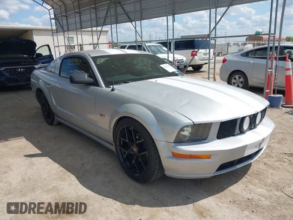 ✅ 2006 Ford Mustang GT Deluxe • VIN: 1ZVFT82H165144359 • Lot: 42922829. Listed on IAAI with 143,130 mi. Free auction sales archive from the USA and detailed vehicle history report at DreamBid. Image 1.
