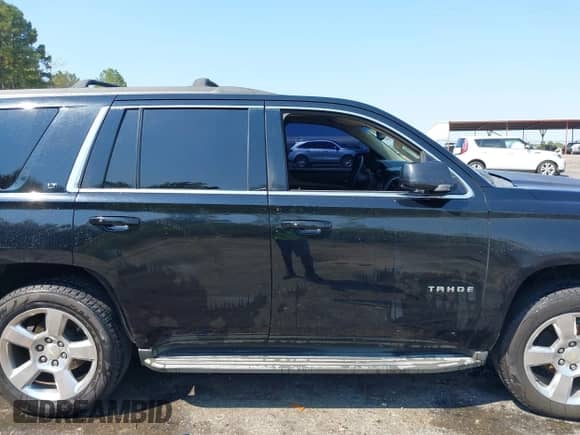 2015 Chevrolet Tahoe LT with VIN 1GNSCBKC0FR161589, listed as a IAAI auction lot 43190542 with 188,450 mi miles and . Bid and sale history available at DreamBid. Image 13.