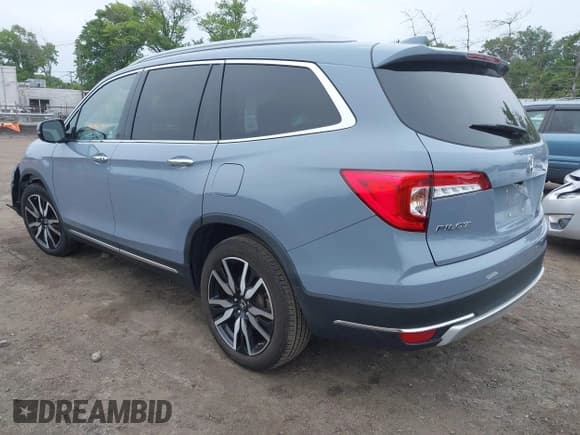 ✅ 2022 Honda Pilot Touring 7-Passenger • VIN: 5FNYF6H68NB056077 • Lot: 42357338. Listed on IAAI with 18,193 mi. Free auction sales archive from the USA and detailed vehicle history report at DreamBid. Image 3.