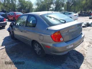 2005 Hyundai Accent GLS z VIN KMHCG35C25U348410, wystawiony jako IAAI lot #41729780 z przebiegiem 166 216 mil mil oraz . Historia ofert i sprzedaży dostępna na DreamBid. Obrazek 3.