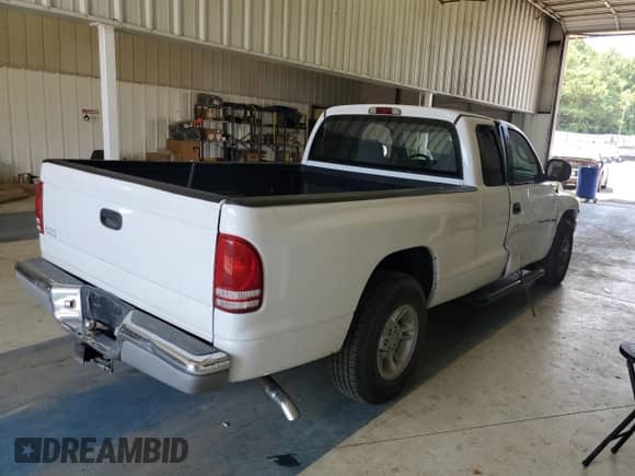 2000 Dodge Dakota z VIN 1B7GL22X5YS571012, wystawiony jako Copart lot #67688924 z przebiegiem 141 562 mil mil oraz Szkoda całkowita • Salvage title. Historia ofert i sprzedaży dostępna na DreamBid. Obrazek 3.