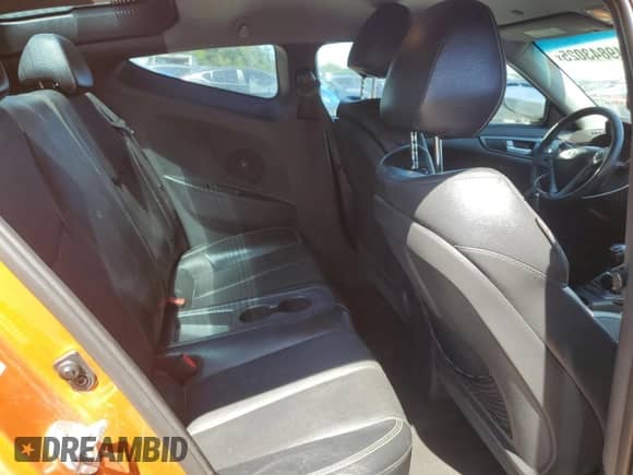 2013 Hyundai Veloster Turbo z VIN KMHTC6AE5DU166493, wystawiony jako Copart lot #81244455 z przebiegiem 116 148 mil mil oraz Szkoda całkowita • Salvage title. Historia ofert i sprzedaży dostępna na DreamBid. Obrazek 10.