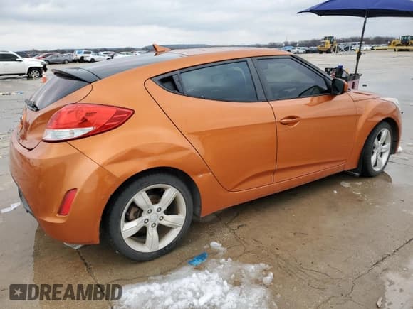 ✅ 2013 Hyundai Veloster w/Black Int • VIN: KMHTC6AD0DU135742 • Lot: 88053675. Listed on Copart with 102,920 mi. Free auction sales archive from the USA and detailed vehicle history report at DreamBid. Image 3.