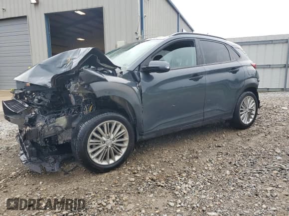 ✅ 2021 Hyundai Kona SEL • VIN: KM8K22AA7MU706642 • Лот: 64498245. Опубликован ранее на Copart с пробегом 99 999 миль. Бесплатный доступ к архиву аукционных продаж из США и подробный отчёт об истории автомобиля на DreamBid. Изображение 1.