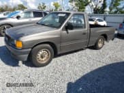 ✅ 1995 Isuzu Pickup S • VIN: JAACL11L8S7200788 • Лот: 51145765. Опубликован ранее на Copart с пробегом 328 108 миль. Бесплатный доступ к архиву аукционных продаж из США и подробный отчёт об истории автомобиля на DreamBid. Изображение 1.