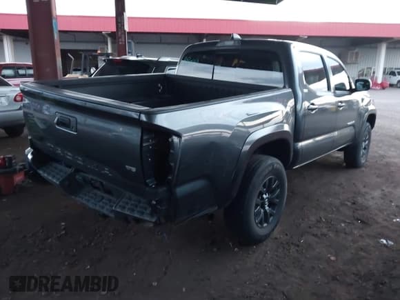 ✅ 2023 Toyota Tacoma SR5 • VIN: 3TMAZ5CN6PM199982 • Lot: 43087053. Listed on IAAI with 38,883 mi. Free auction sales archive from the USA and detailed vehicle history report at DreamBid. Image 4.