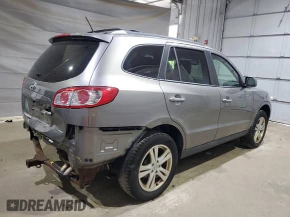 2012 Hyundai Santa Fe Limited с VIN 5XYZKDAG5CG144226, выставлен на аукционе Copart как лот 70772505 с пробегом 176 332 миль миль и Списание • Salvage title. История ставок и продаж доступна на DreamBid. Изображение 3.