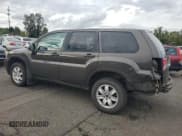 ✅ 2011 Mitsubishi Endeavor LS • VIN: 4A4JM2AS1BE023886 • Lot: 86185465. Listed on Copart with 217,231 mi. Free auction sales archive from the USA and detailed vehicle history report at DreamBid. Image 2.