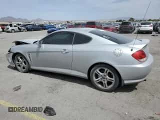 2006 Hyundai Tiburon GT с VIN KMHHN65F06U203701, выставлен на аукционе Copart как лот 52374135 с пробегом 90 796 миль миль и Списание • Salvage title. История ставок и продаж доступна на DreamBid. Изображение 2.