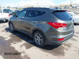 2014 Hyundai Santa Fe z VIN 5XYZU3LA4EG186807, wystawiony jako IAAI lot #43393062 z przebiegiem 67 944 mil mil oraz . Historia ofert i sprzedaży dostępna na DreamBid. Obrazek 3.
