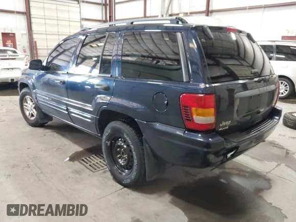 ✅ 2004 Jeep Grand Cherokee Laredo • VIN: 1J4GW48N34C323803 • Lot: 43519623. Listed on IAAI with 179,258 mi. Free auction sales archive from the USA and detailed vehicle history report at DreamBid. Image 3.
