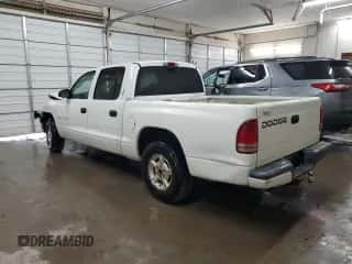 2002 Dodge Dakota Sport z VIN 1B7HL38XX2S650989, wystawiony jako Copart lot #73746534 z przebiegiem 392 280 mil mil oraz Szkoda całkowita • Salvage title. Historia ofert i sprzedaży dostępna na DreamBid. Obrazek 2.