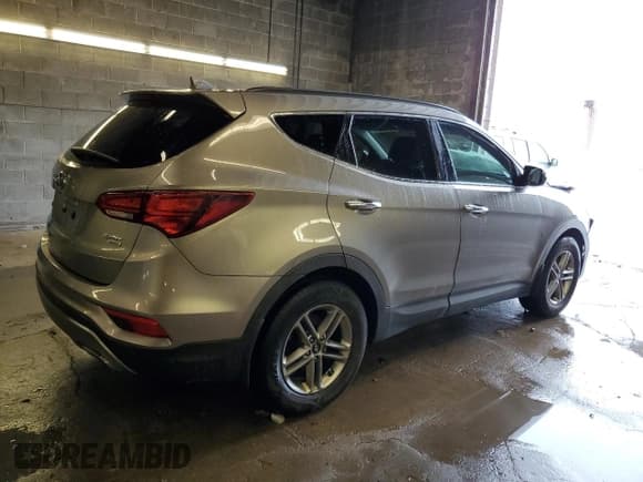 ✅ 2018 Hyundai Santa Fe 2.4L • VIN: 5NMZUDLB5JH069977 • Лот: 38550574. Опубликован ранее на Copart с пробегом 64 463 миль. Бесплатный доступ к архиву аукционных продаж из США и подробный отчёт об истории автомобиля на DreamBid. Изображение 3.
