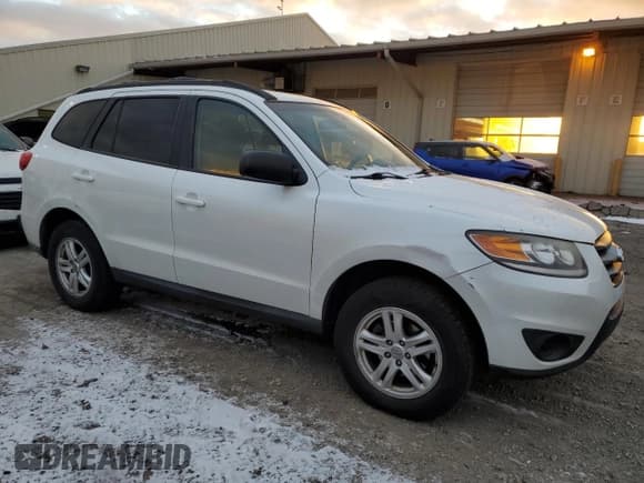 ✅ 2012 Hyundai Santa Fe GLS • VIN: 5XYZGDAB8CG118659 • Lot: 83682914. Listed on Copart with 174,014 mi. Free auction sales archive from the USA and detailed vehicle history report at DreamBid. Image 4.