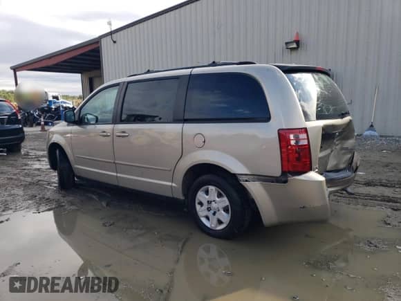2009 Dodge Grand Caravan SE with VIN 2D8HN44E79R651812, listed as a Copart auction lot 85851955 with 253,916 mi miles and Salvage title. Bid and sale history available at DreamBid. Image 2.