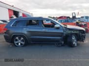 ✅ 2015 Jeep Grand Cherokee Overland • VIN: 1C4RJFCG3FC697994 • Lot: 40526924. Listed on IAAI with 199,275 mi. Free auction sales archive from the USA and detailed vehicle history report at DreamBid. Image 13.