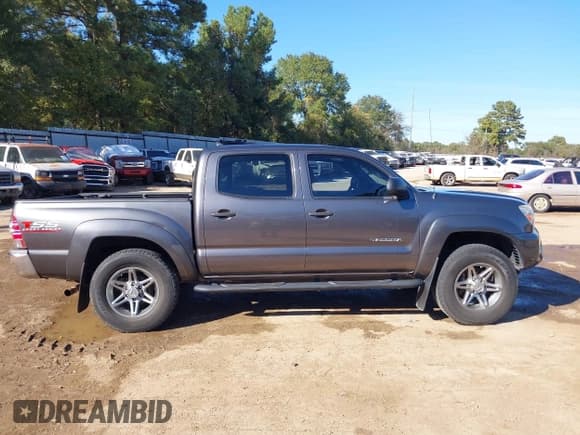 ✅ 2014 Toyota Tacoma PreRunner • VIN: 5TFJU4GN5EX058881 • Lot: 43603920. Listed on IAAI with 170,876 mi. Free auction sales archive from the USA and detailed vehicle history report at DreamBid. Image 14.