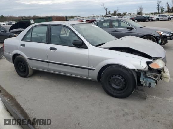 ✅ 2001 Mazda Protege DX • VIN: JM1BJ222310425181 • Lot: 88560255. Wystawiony na Copart z przebiegiem 201 942 mil. Bezpłatny archiwum sprzedaży aukcyjnych z USA i szczegółowy raport historii pojazdu na DreamBid. Zdjęcie 4.