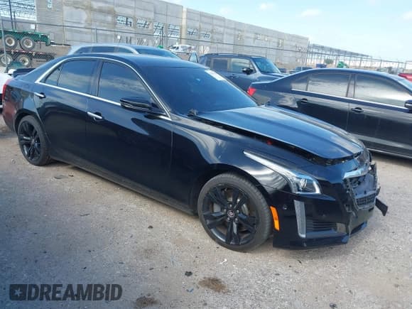 ✅ 2014 Cadillac CTS Vsport RWD • VIN: 1G6AU5S80E0157000 • Lot: 42421328. Listed on IAAI with 130,953 mi. Free auction sales archive from the USA and detailed vehicle history report at DreamBid. Image 1.