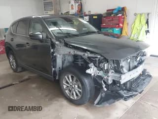 ✅ 2022 Mazda CX-5 S Carbon Edition • VIN: JM3KFBCM1N0577670 • Lot: 43821338. Listed on IAAI with 59,967 mi. Free auction sales archive from the USA and detailed vehicle history report at DreamBid. Image 1.