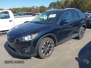 ✅ 2016 Mazda CX-5 Grand Touring • VIN: JM3KE2DY5G0715623 • Lot: 43582561. Wystawiony na IAAI z przebiegiem 166 935 mil. Bezpłatny archiwum sprzedaży aukcyjnych z USA i szczegółowy raport historii pojazdu na DreamBid. Zdjęcie 2.