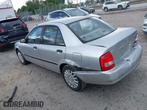 ✅ 2003 Mazda Protege DX • VIN: JM1BJ225331136793 • Lot: 42775972. Listed on IAAI with 188,046 mi. Free auction sales archive from the USA and detailed vehicle history report at DreamBid. Image 3.