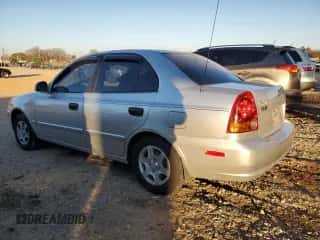 2003 Hyundai Accent GL with VIN KMHCG45C93U496038, listed as a Copart auction lot 87260904 with 104,251 mi miles and Salvage title. Bid and sale history available at DreamBid. Image 2.